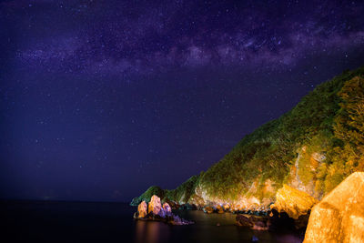 Scenic view of sea against sky at night