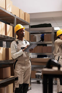 Side view of man working in factory