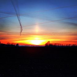 Scenic view of landscape at sunset