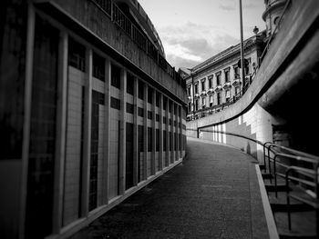 Street amidst buildings against sky