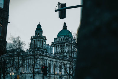 Low angle view of building against sky in city