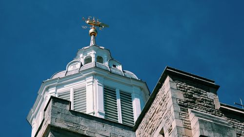 Low angle view of building against blue sky