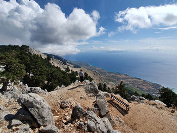 High angle view of rocks by sea against sky