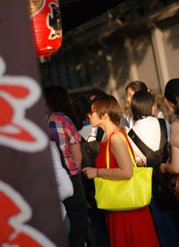 Rear view of people on road