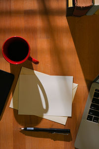 High angle view of coffee cup on table