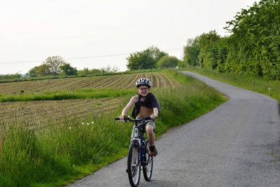 Man riding bicycle on road