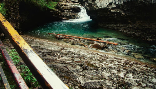 River flowing by rock formation