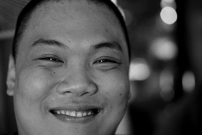 Close-up portrait of smiling mid adult man