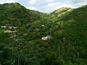 Scenic view of mountains against cloudy sky