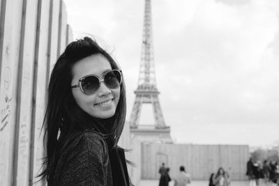 Portrait of woman against eiffel tower