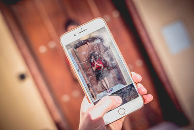 Close-up of hand holding smart phone