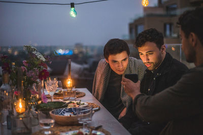 People sitting in restaurant at night