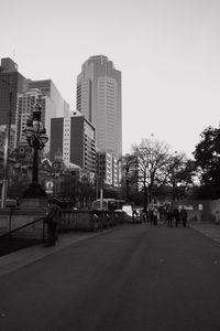 City street and buildings against sky