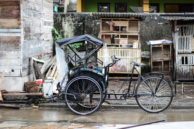Bicycles on street against old building