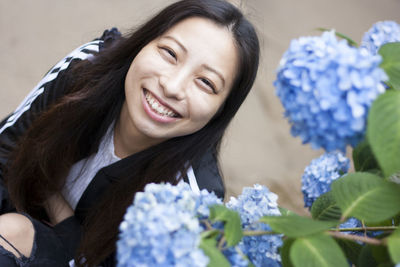 Close-up portrait of a smiling young woman