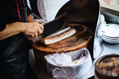 Close-up of man preparing food