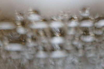 Full frame shot of snowflakes on water