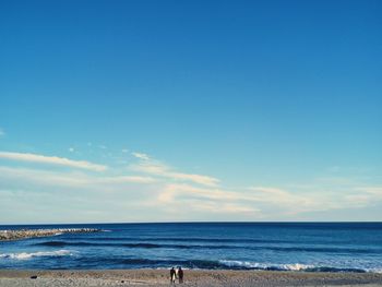 Scenic view of sea against clear blue sky