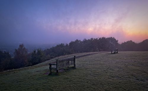 Scenic view of field against sky during sunset