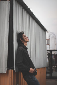 Side view of young man looking away