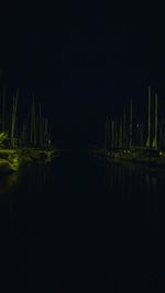 Scenic view of lake against sky at night