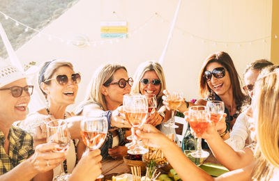 Group of people drinking glass outdoors