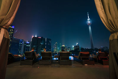 Illuminated buildings in city at night