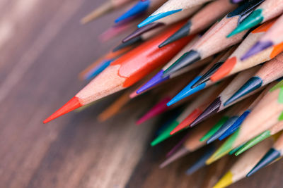 Close-up of colored pencils on table