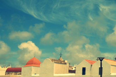 Low angle view of built structure against cloudy sky