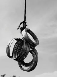 Low angle view of hanging against sky