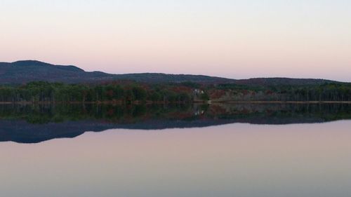 Scenic view of lake at sunset