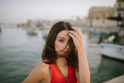 Portrait of a beautiful young woman in water