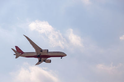 Low angle view of airplane against sky