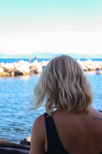 Rear view of woman looking at sea