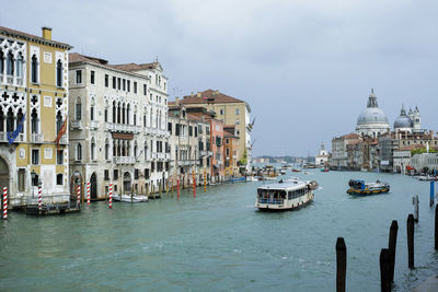 Boats in city at waterfront