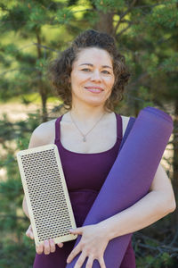 Portrait of young woman using laptop