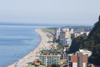 Sea beach, people during holidays in black sea, georgia