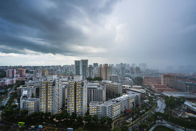 High angle view of buildings in city against sky