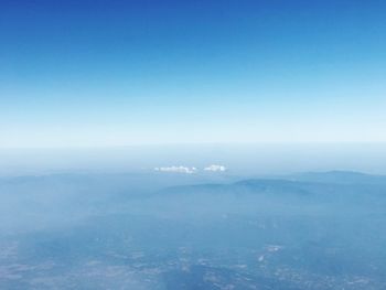 Scenic view of sea against blue sky