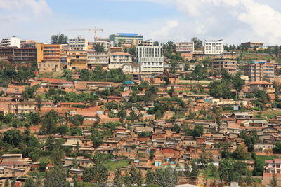 Landscape urban scene of shanty town and housing in hills of kigali, rwanda.