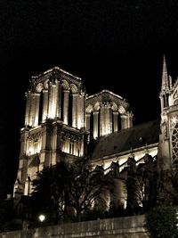 Low angle view of illuminated building at night