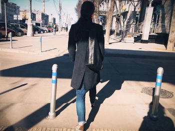 Full length of woman standing in city