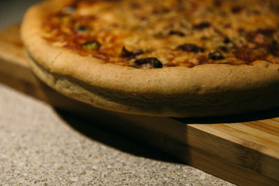 Close-up of pizza on cutting board