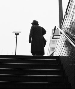 Rear view of man against clear sky