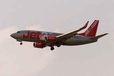 Airplane flying against clear sky