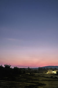 Scenic view of field against sky during sunset