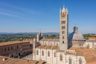 Buildings in city against sky