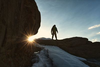 Rear view of man walking on mountain