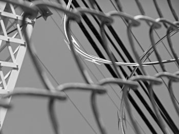 Barbed wire fence against sky