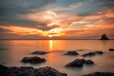 Scenic view of sea at sunset